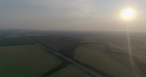 Flight over fields and highway Stock Footage 107055445
