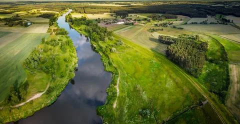 Flight over the fields and river Stock Photos