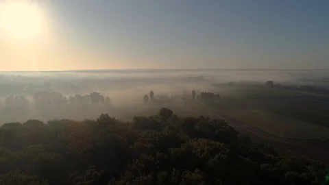 Flight over fields in the fog, aerial view Stock Footage 120407933