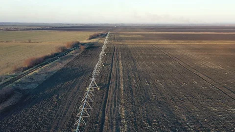 Flight over the fields with large irrigation system Video stock 124984375