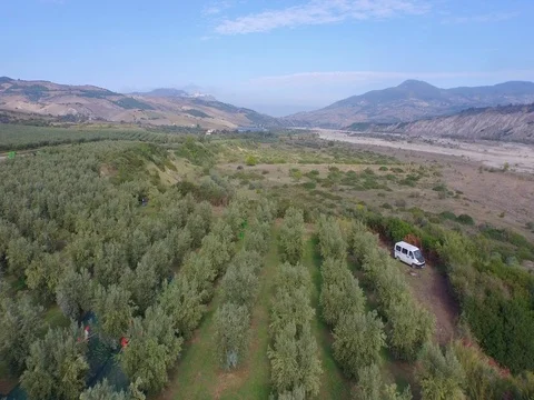 Flight over fields towards the town Stock Footage 72445979