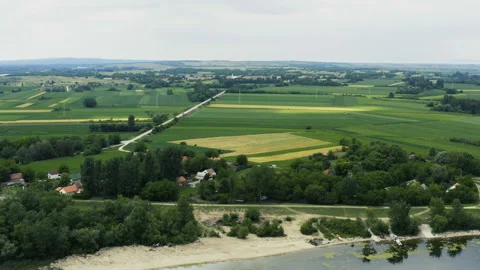 Flight over the fields of wheat by the river Danube Stock Footage 132594286