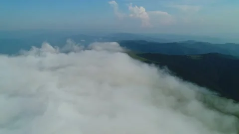 Flight over the fog over Mount Gemba. Ukrainian Carpathian Mountains. Video stock 142229703