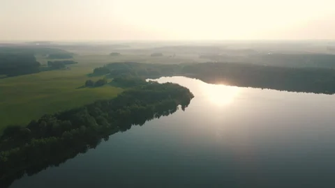 Flight over the forest and lake Stock Footage 141821840