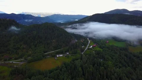 Flight over forest with clouds in Norway Stock Footage 148573883