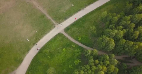 Flight over the forest. People running along the road.Aerial View. Flying over t Stock Footage 96446260