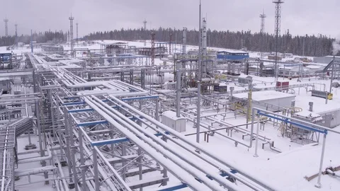 Flight over frozen pipes on winter gas field Stock-Footage 123764248
