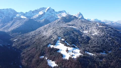 Flight Over Gorge Towards Towering Snow-Capped Mountain Stock Footage 297621928