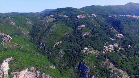 Flight over Greece Corfu mountain village aerial 4k travel video. Houses hills Stock Footage 66571165