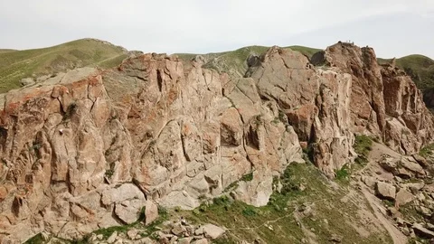 Flight over green fields and rocks. The Alpine camp. Shooting from the air. Video stock 88561345