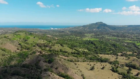 Flight over the green jungle that grows on the hills on Haiti island Stock Footage 101487316
