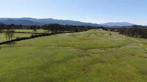 Flight over green meadows Stock Footage 128976031