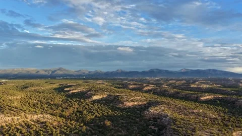 Flight Over Green Mesas And A Fading Rainbow Stock Footage 345175468