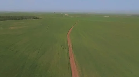 Flight over the green wheat field - flying away Видео 61844797