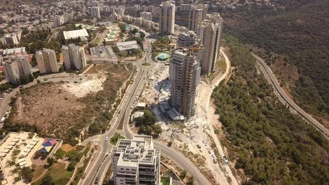 A flight over the Haifa quarter, lone cars passing through the streets, 2 Stock Footage 119312341