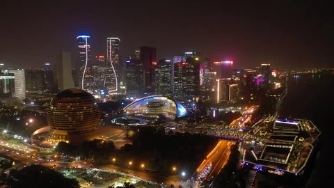 Flight over hangzhou city downtown night illumination aerial panorama 4k china Stock Footage 125489333