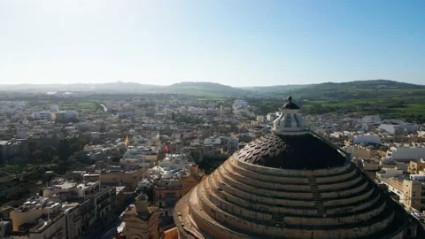 Flight over high spire tower around house surrounding city Shooting from drone Stock Footage 233595607