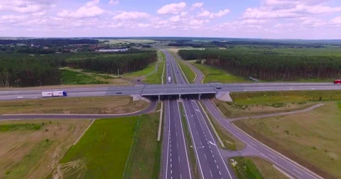 Flight over highway crossing Stock Footage 65599763