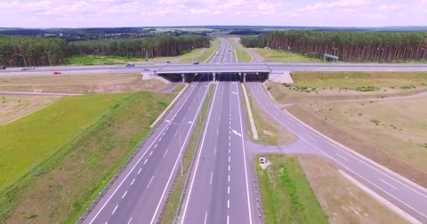 Flight over highway crossing Stock Footage 65601174