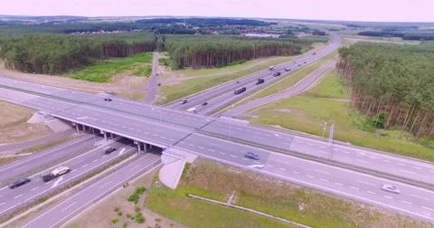 Flight over highway crossing Stock Footage 65601685