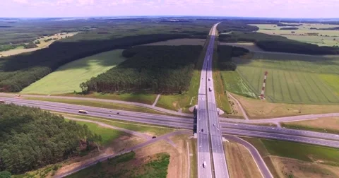 Flight over highway crossing Stock Footage 65603935