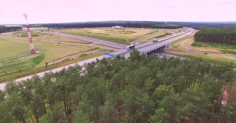 Flight over highway crossing Stock Footage 65604614