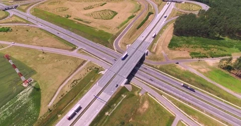 Flight over highway crossing Stock Footage 65604883