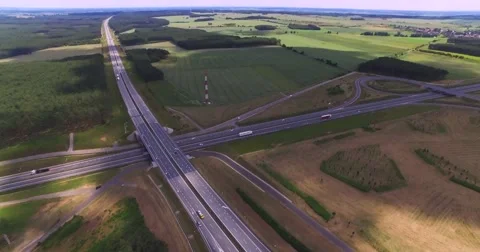 Flight over highway crossing Stock Footage 65605099