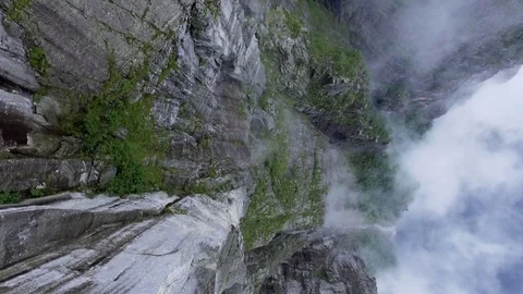 Flight over huge rocks, view from above. Fog in the crevice between the Video stock 79975688