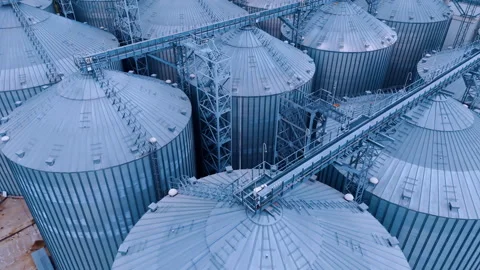 Flight over the huge tops of stainless steel elevators.  Stock Footage 297994959