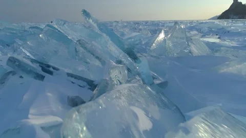 Flight over hummocks, ice ridges of frozen Lake Baikal, Siberia field hovercraft Stock Footage 316454648