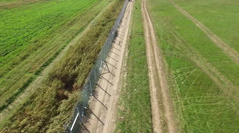Flight over of Hungarian - Serbian border wire fence. 2015. September Stock Footage 61065187