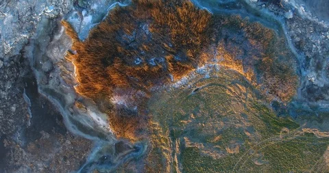 Flight over the ice covered and cracked ice lagoon. Sunset. Long shadows Stock Footage 101552123