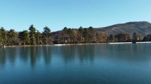 Flight over an icy lake in winter Stock Footage 167580786