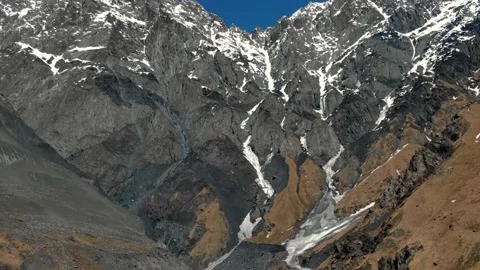 Flight over incredible epic mountain landscape winter snow covered sharp peaks Video stock 237768432