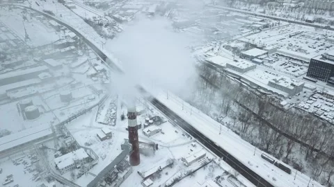 Flight over the industrial zone to the pipe of the heat power network with a Stock Footage 218431228