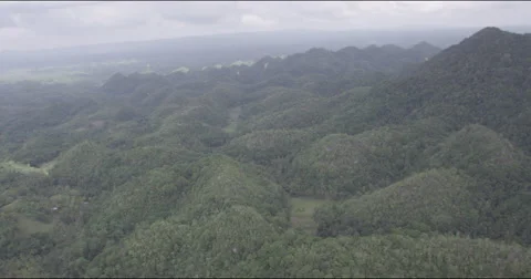 Flight over karst formations covered tropical forest Video stock 45748621