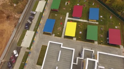 Flight over kindergarten.Helicopter.Flight over building Stock Footage 101575261
