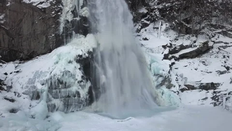 Flight over of Krimml Waterfall in winter Video stock 161973383