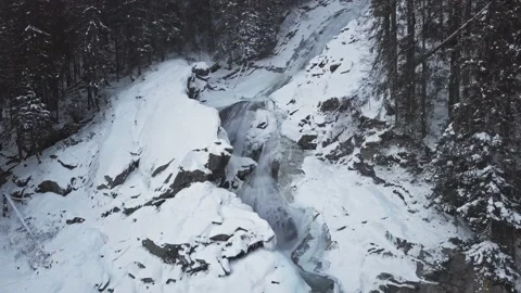 Flight over of Krimml Waterfall in winter Stock Footage 217932216