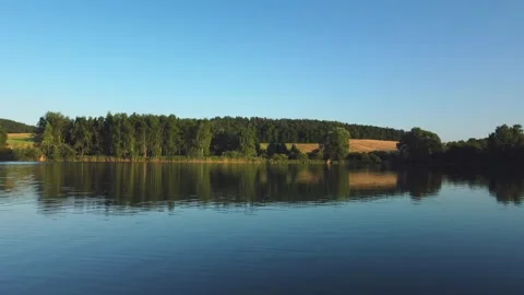 Flight over the lake and fields. Traveling through the Czech Republic Stock Footage 244915333