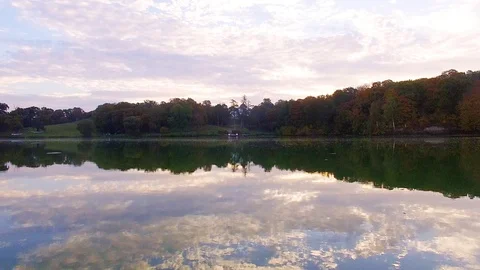 Flight over the lake at dawn Stock Footage 125262912
