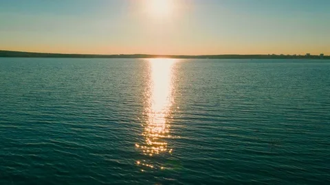 Flight over the lake during sunset Stock Footage 79388734