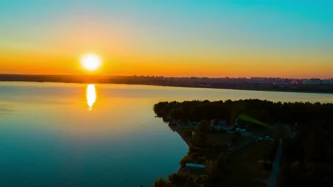 Flight over the lake during sunset Stock Footage 79388738