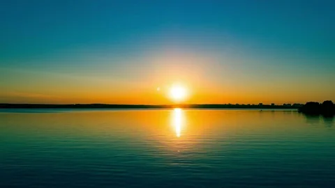 Flight over the lake during sunset Stock Footage 79388821