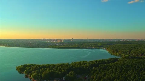 Flight over the lake during sunset Stock Footage 79388912