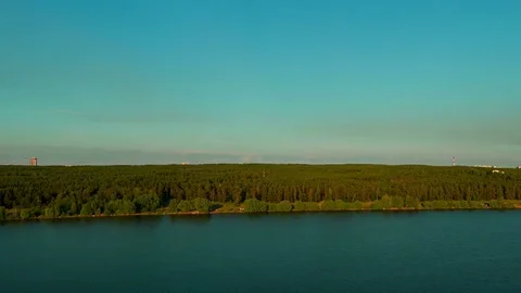 Flight over the lake during sunset Stock Footage 79389123