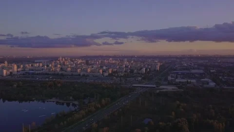 Flight over the lake during sunset overlooking the city with beautiful clouds Stock Footage 145211466