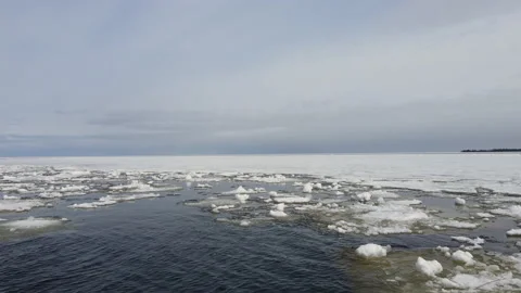 Flight over the lake in spring, drifting ice. Karelia. Video stock 153105629