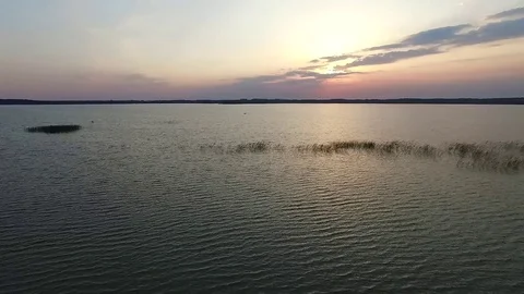 Flight over the lake sundown Stock Footage 99118940